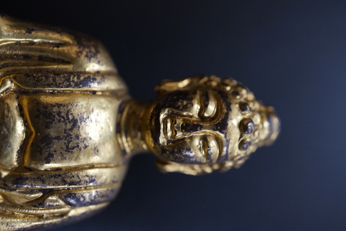 A Chinese miniature gilt metal figure of seated Buddha, 8cm high